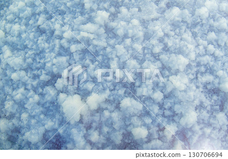 Close-up of salt crystals on the lake surface, unique natural texture Close-up of salt crystals on the lake surface, unique natural texture 130706694