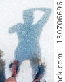 Human shadow on the salt surface of the lake, abstract pattern on a white background 130706696
