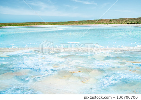 Salt lake with turquoise water and white salt crystals on the surface Salt lake with turquoise water and white salt crystals on the surface 130706700