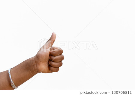 Hand thumb up. Kid good great job thump up show agree accept ok. Child's hand showing thumb up, like, isolated on a white background. Copy space for text 130706811