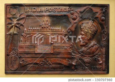 Celebrate silver jubilee of coronation of King George V(1935) British Government issued stamp depicting Sri Sital Nath Jain Temple, Street bass relief on the wall of Jain Temple (also called 130707360