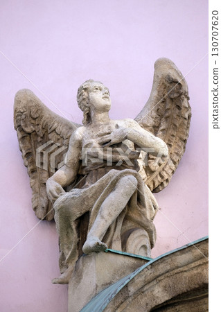 Angel statue on the facade of the Saint Francis church in Budapest, Hungary Angel statue on the facade of the Saint Francis church in Budapest, Hungary 130707620