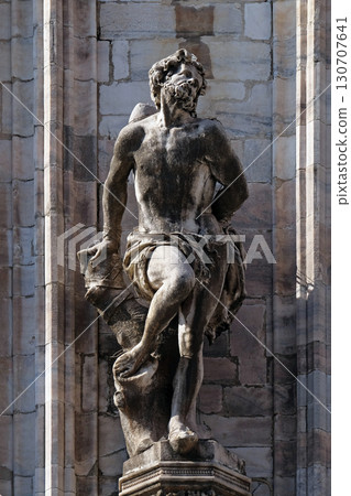 Statue of Saint on the facade of the Milan Cathedral, Duomo di Santa Maria Nascente, Milan, Lombardy, Italy Statue of Saint on the facade of the Milan Cathedral, Duomo di Santa Maria Nascente, Milan, Lombardy, Italy 130707641