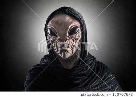 Mysterious humanoid alien at night over dark misty background  130707678