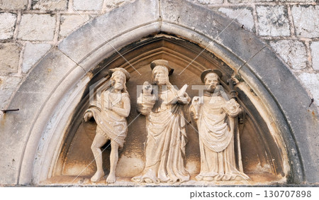 Jesus Christ, St. John the Baptist and St. Nicholas with a stick, portal of Saint Luke Church in Dubrovnik, Croatia Jesus Christ, St. John the Baptist and St. Nicholas with a stick, portal of Saint Luke Church in Dubrovnik, Croatia 130707898