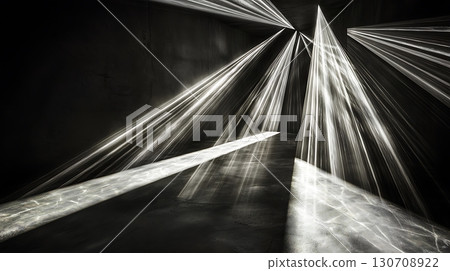 A black and white photo of a room with a light shining on the floor A black and white photo of a room with a light shining on the floor 130708922
