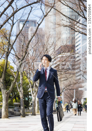 Businessman talking on smartphone Businessman talking on smartphone 130708964