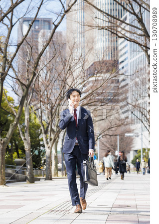 Businessman talking on smartphone Businessman talking on smartphone 130708989