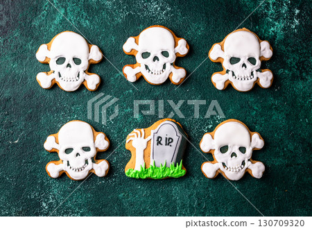 Halloween cookies in shape of ghost, jack-o-lantern and skull 130709320