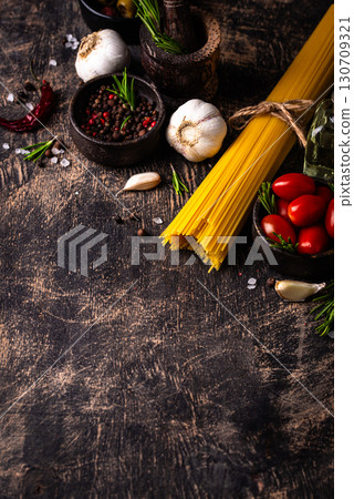 Italian food background with spaghetti, tomato and spices 130709321