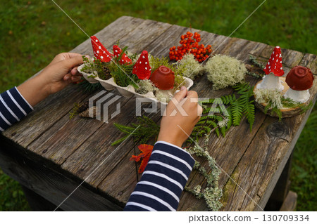 Fall-themed project made from natural and repurposed materials, featuring a mushroom design. 130709334