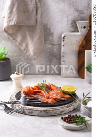 Salted sliced salmon fish with herbs 130709350