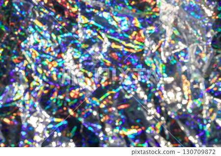 Abstract defocused holographic patterns creating colorful shimmering effects 130709872