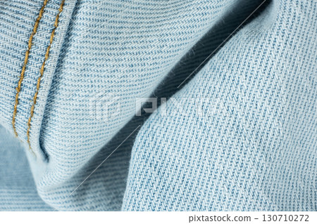 Detailed View of Blue Jeans Fabric and Thread Stitching Detailed View of Blue Jeans Fabric and Thread Stitching 130710272