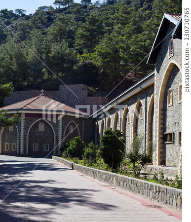 The monastery's historic stone buildings with arched windows and red-tiled roofs 130710765