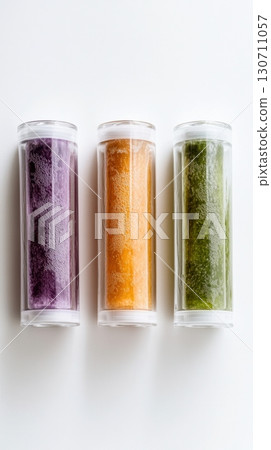 Colorful trio of transparent frozen drink cylinders on white background Colorful trio of transparent frozen drink cylinders on white background 130711057