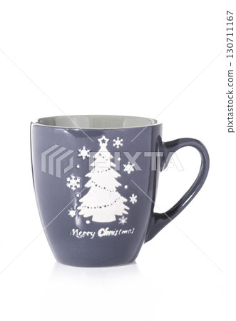 A gray Christmas mug featuring a white Christmas tree, snowflakes, isolated on a white background. A gray Christmas mug featuring a white Christmas tree, snowflakes, isolated on a white background. 130711167