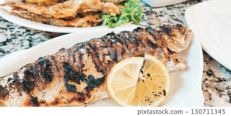 Rainbow trout, grilled, with lemon, and crispy fried lamb, mobile photo, no people, Rainbow trout, grilled, with lemon, and crispy fried lamb, mobile photo, no people, 130711345