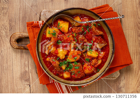 Potatoes with meat, stewed in tomato sauce, with spices and herbs, homemade, no people, Potatoes with meat, stewed in tomato sauce, with spices and herbs, homemade, no people, 130711356