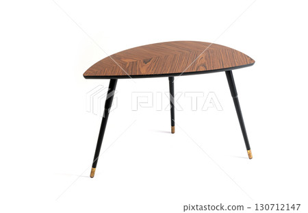 A stylish modern coffee table with a triangular, standing on a white background. A stylish modern coffee table with a triangular, standing on a white background. 130712147