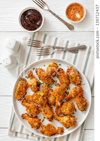 Panko breaded oven baked chicken wings on plate Panko breaded oven baked chicken wings on plate 130712437