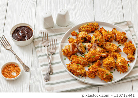 Panko breaded oven baked chicken wings on plate 130712441