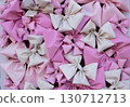 Decorating the house's exterior wall with pink bows. 130712713