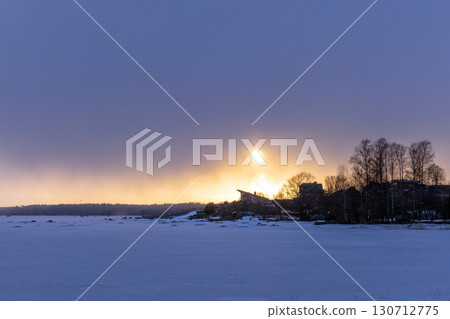 Natural winter landscape photography featuring bare trees silhouettes 130712775