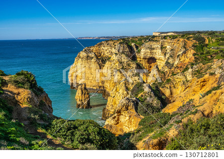Ponta da Piedade is a unique rock formation with famous grottos in the ocean at Lagos, Algrave, Portugal Ponta da Piedade is a unique rock formation with famous grottos in the ocean at Lagos, Algrave, Portugal 130712801