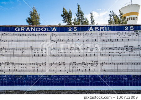 Tile mural with carnation and lyrics from the commemorative song of the 25th of April Grandola Vila Morena in Grandola, Portugal 130712809