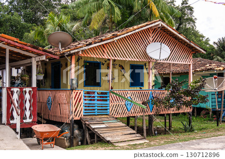 Colorful natural-framed houses with balconies at Pesqueiro, Soure in Marajo Island, Brazil. Colorful natural-framed houses with balconies at Pesqueiro, Soure in Marajo Island, Brazil. 130712896