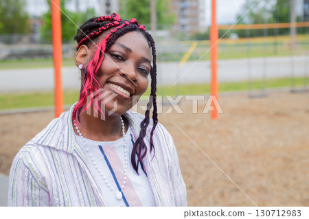 African American Kindergarten Teacher Outdoors at Playground African American Kindergarten Teacher Outdoors at Playground 130712983