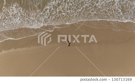 Pregnant Woman Relaxing by the Ocean Aerial Beach Photography Pregnant Woman Relaxing by the Ocean Aerial Beach Photography 130713169