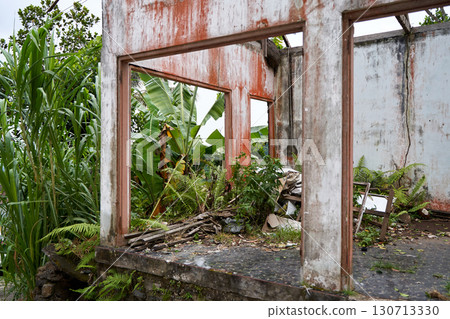 Walls from an abandoned old ruined house without a roof after a catastrophe. Walls from an abandoned old ruined house without a roof after a catastrophe. 130713330