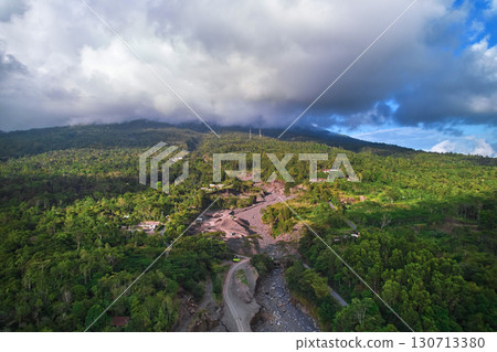 A beautiful valley under an active volcano. An old river made of ash and lava where minerals are mined. 130713380