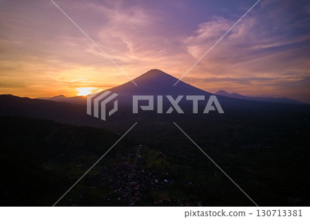 Silhouette of the Agung volcano at sunset. Panorama of the mountain on the island of Bali. 130713381