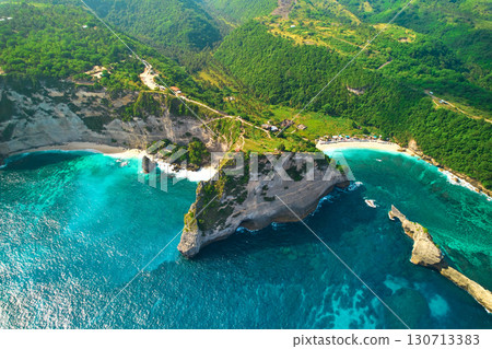 Cinematic aerial landscape shots of the beautiful island Diamond beach of Nusa Penida. Huge cliffs by the shoreline and hidden dream beaches with clear water. Cinematic aerial landscape shots of the beautiful island Diamond beach of Nusa Penida. Huge cliffs by the shoreline and hidden dream beaches with clear water. 130713383