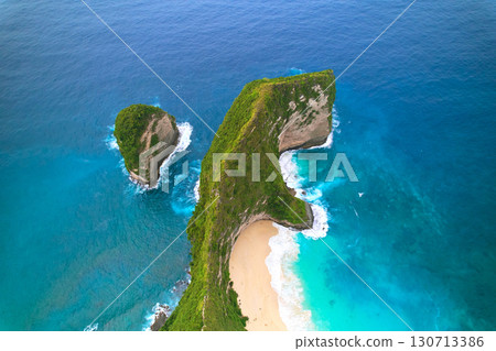 Cinematic aerial landscape shots of the beautiful island dinosaur of Nusa Penida. Huge cliffs by the shoreline and hidden dream beaches with clear water. Cinematic aerial landscape shots of the beautiful island dinosaur of Nusa Penida. Huge cliffs by the shoreline and hidden dream beaches with clear water. 130713386