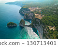 Cinematic aerial landscape shots of the beautiful island Diamond beach of Nusa Penida. Huge cliffs by the shoreline and hidden dream beaches with clear water. 130713401