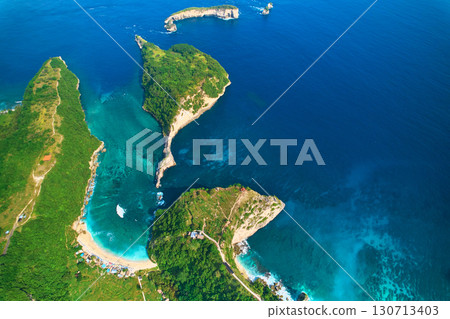 Cinematic aerial landscape shots of the beautiful island Diamond beach of Nusa Penida. Huge cliffs by the shoreline and hidden dream beaches with clear water. Cinematic aerial landscape shots of the beautiful island Diamond beach of Nusa Penida. Huge cliffs by the shoreline and hidden dream beaches with clear water. 130713403