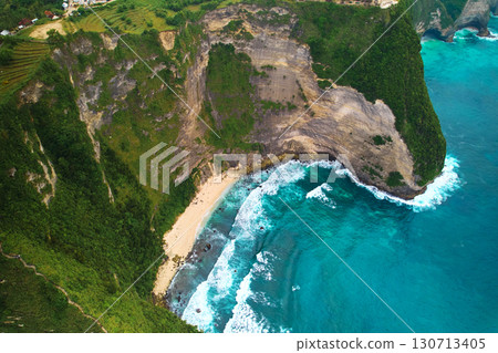Cinematic aerial landscape shots of the beautiful island dinosaur of Nusa Penida. Huge cliffs by the shoreline and hidden dream beaches with clear water. Cinematic aerial landscape shots of the beautiful island dinosaur of Nusa Penida. Huge cliffs by the shoreline and hidden dream beaches with clear water. 130713405