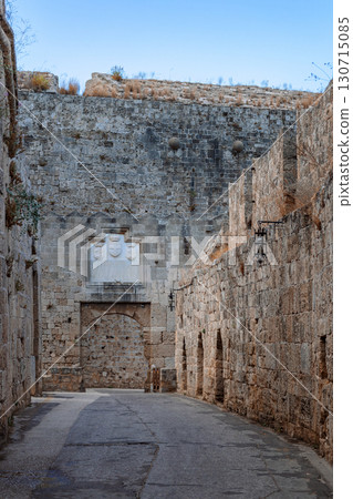 Stone powerful walls of old city, the ancient defense of Old Town, Rhodes, Dodecanese, Greece. High quality photo Stone powerful walls of old city, the ancient defense of Old Town, Rhodes, Dodecanese, Greece. High quality photo 130715085