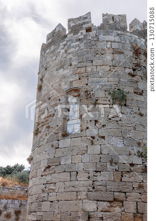Stone powerful walls of old city, the ancient defense of Old Town, Rhodes, Dodecanese, Greece. High quality photo Stone powerful walls of old city, the ancient defense of Old Town, Rhodes, Dodecanese, Greece. High quality photo 130715088