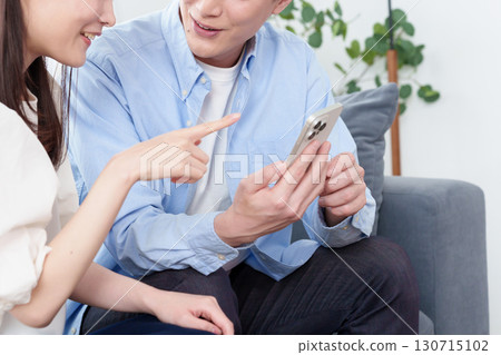 Hands of young men and women using smartphones Hands of young men and women using smartphones 130715102