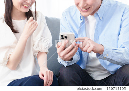 Hands of young men and women using smartphones Hands of young men and women using smartphones 130715105