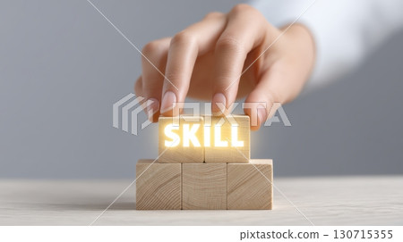 Upskilling and Reskilling in Learning and Development concept, Hand stacking wooden blocks with skill text concept for development 130715355
