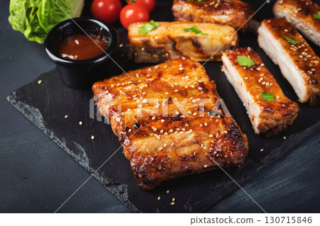 Barbecue pork spare ribs with hot honey chili marinade on black background 130715846