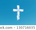 A cloud shaped like a Christian cross floating in a clear blue sky. Symbol of faith, hope, and spirituality 130716035