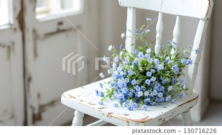 Image of a blue bouquet placed on a white antique chair Background Wallpaper Material 130716226