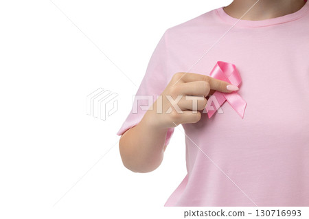 Hand adds pink ribbon for support, isolated on white, PNG Hand adds pink ribbon for support, isolated on white, PNG 130716993